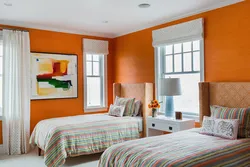 Orange wallpaper in the bedroom interior