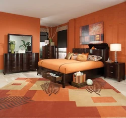 Orange wallpaper in the bedroom interior