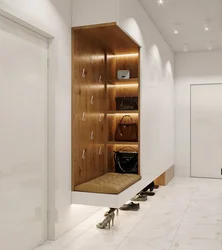 Wardrobe in the hallway with a shoe rack in a modern style photo