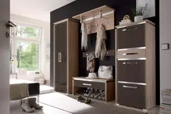 Wardrobe in the hallway with a shoe rack in a modern style photo