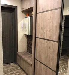Wardrobe in the hallway with a shoe rack in a modern style photo