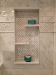 Niche in the bathroom for shampoos made of tiles photo