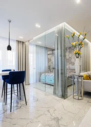 Glass partition in the living room interior