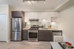 Kitchen design along one wall with a refrigerator photo