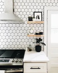 Kitchens with black tiles on the wall photo