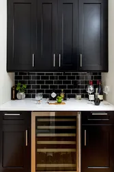 Kitchens with black tiles on the wall photo