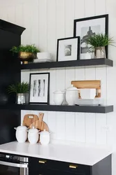 Shelves on the wall in the kitchen interior above the table