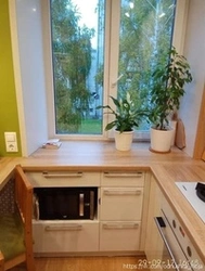 Kitchen by the window in a Khrushchev apartment photo