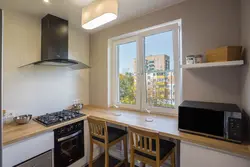 Kitchen by the window in a Khrushchev apartment photo