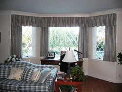 Curtains up to the window sill in the living room in a modern interior