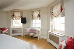 Curtains up to the window sill in the living room in a modern interior