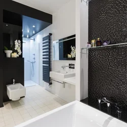 White bathroom design with one black wall