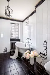 White bathroom design with one black wall