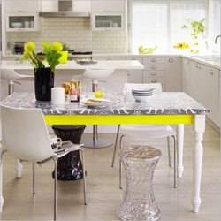Photo of a kitchen with a white table