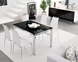 Photo of a kitchen with a white table