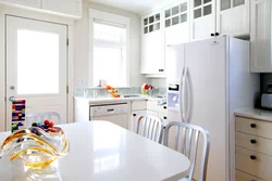 Photo of a kitchen with a white table