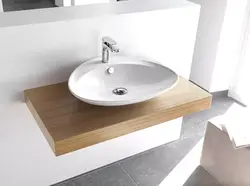Sink on the countertop in the bathroom photo