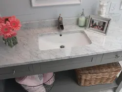 Sink on the countertop in the bathroom photo