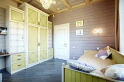 Painting a bedroom in a wooden house photo