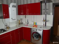 Kitchen with gas water heater and washing machine photo