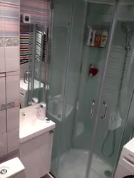 Bathroom with shower in Khrushchev photo cabin and washing machine