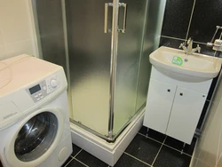 Bathroom with shower in Khrushchev photo cabin and washing machine