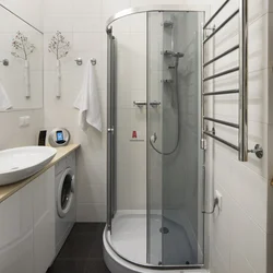 Bathroom with shower in Khrushchev photo cabin and washing machine