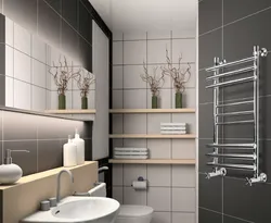 Heated towel rail photo in the bathroom in the apartment