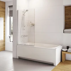 Bathroom bathtub with glass photo
