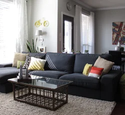 Dark gray sofa in the kitchen interior