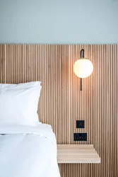 Decorative slats for walls in the bedroom interior