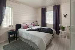 Interior of a bright bedroom in a wooden house