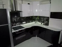 Corner black and white kitchens in the interior photo