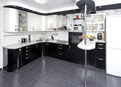 Corner black and white kitchens in the interior photo