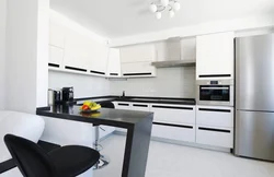 Corner black and white kitchens in the interior photo