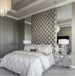 Bedroom design with mirror on the wall