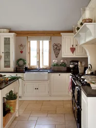Kitchen in a country house with a window in the middle photo
