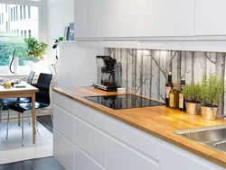 Glass apron for the kitchen interior photo