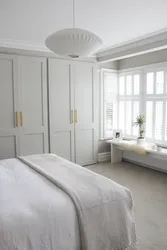 Bedroom design with wardrobe in light colors