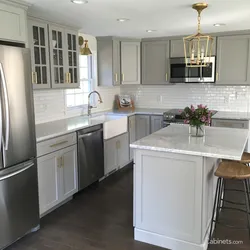 Gray refrigerator in the kitchen interior photo