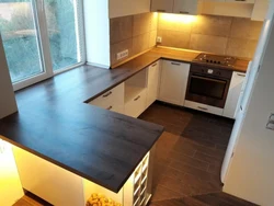 Kitchen combined with window sill photo