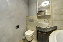 Bathroom design with decorative plaster and tiles photo