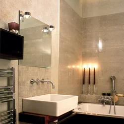 Bathroom design with decorative plaster and tiles photo