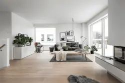 White living room with wood in the interior