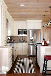 Small kitchen in a wooden house photo