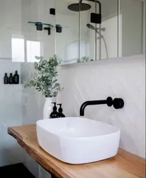Black bathroom taps in the interior
