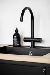Black bathroom taps in the interior
