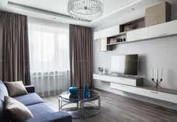 Interior of a square living room with one window