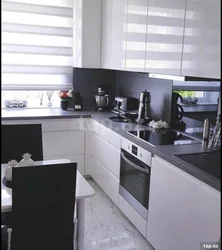 Kitchen With A Gray Countertop In A White Interior And An Apron