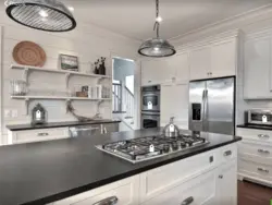 Kitchen With A Gray Countertop In A White Interior And An Apron